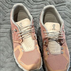On Clouds Running Pink and Beige Athletic Shoes